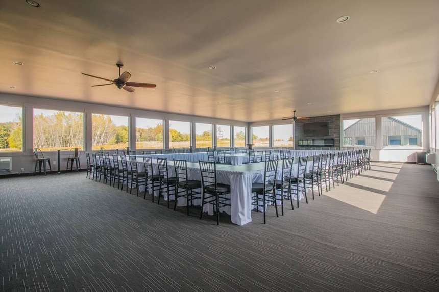 The 60-seat conference room in the Castle, set in a hollow square with autumn woods through the windows