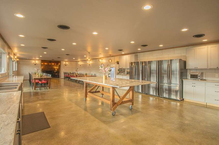 The Castle kitchen with six refrigerators and a long prep island