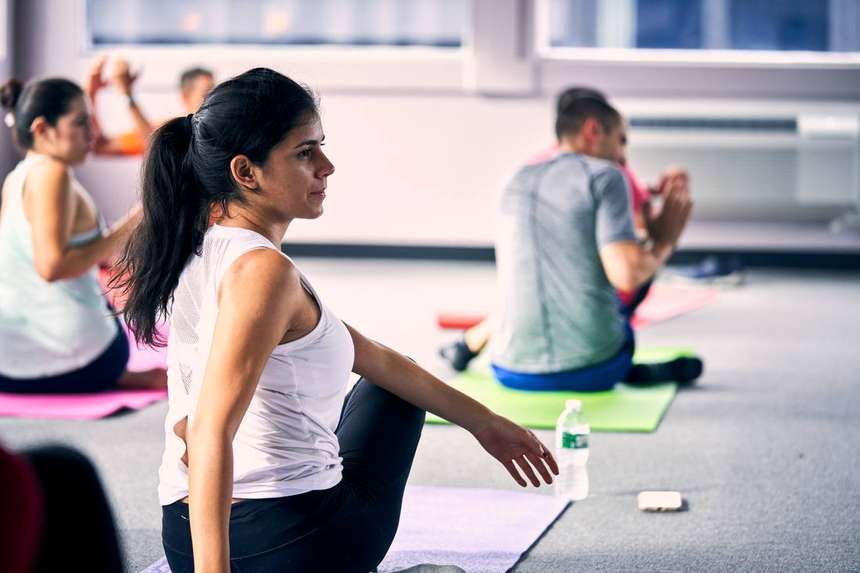 A morning yoga session for a visiting team in the Castle fitness studio